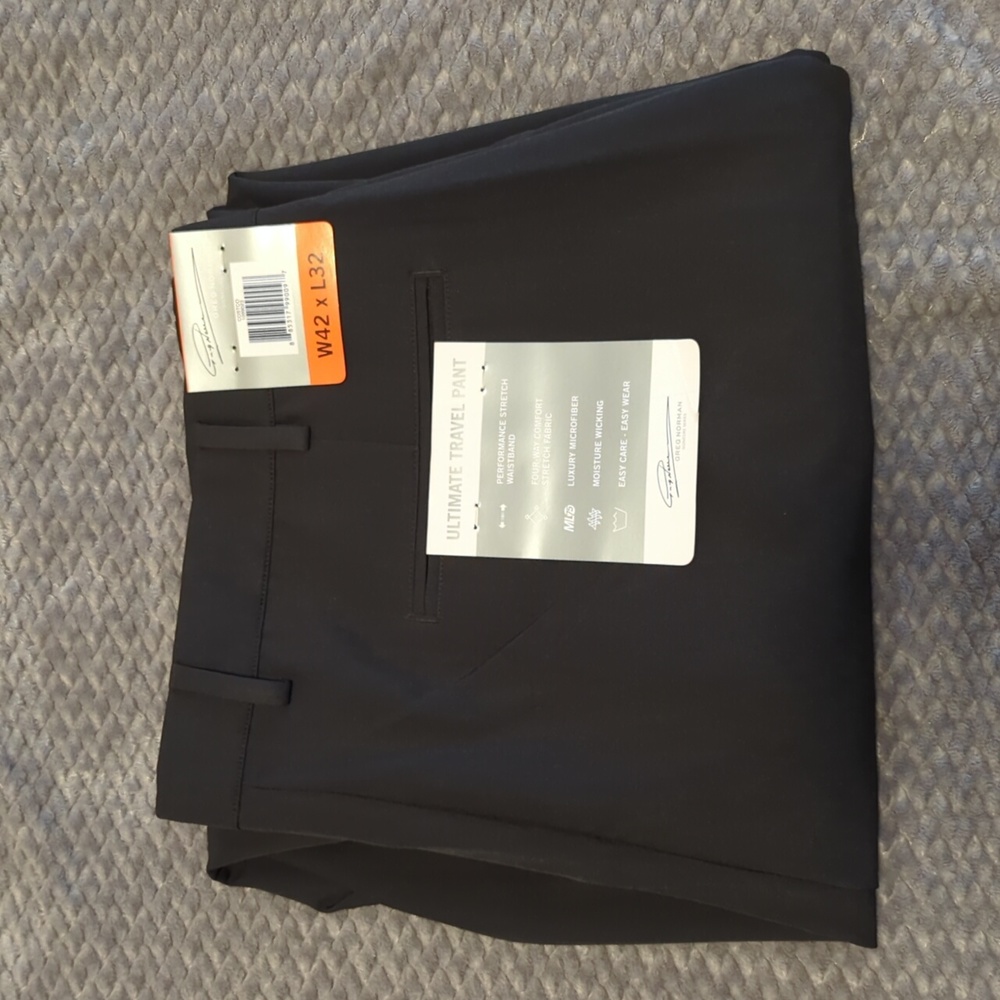 NWT Greg Norman Ultimate Travel Pant. 42 x 32. Black. Never worn.